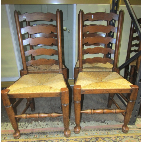 2702 - A set of six (2&4) ladderback dining chairs of traditional form with rush seats