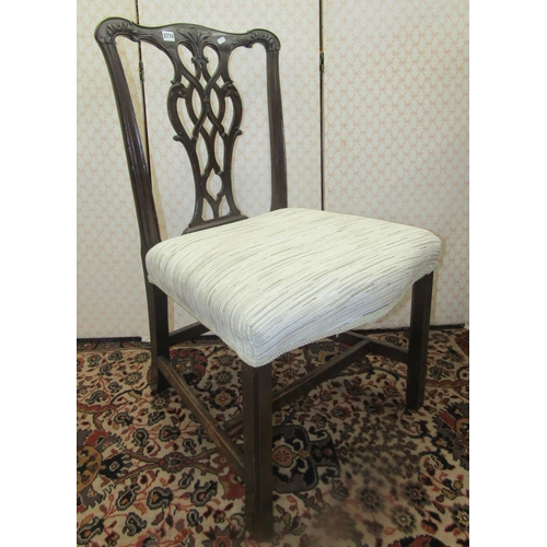 2774 - A simple Georgian mahogany side chair, with shaped cresting rail and carved and pierced splat, stuff... 