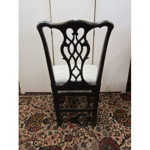 2774 - A simple Georgian mahogany side chair, with shaped cresting rail and carved and pierced splat, stuff... 