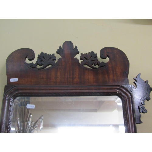 2798 - A Georgian mahogany Swansea type mirror the frame with fretted outline enclosing a bevelled edge mir... 