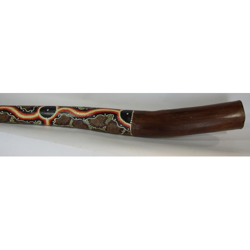 1719 - An Australian aboriginal didgeridoo, with a dot painted decoration, 130 cm approximately