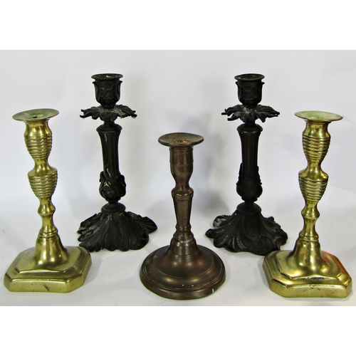 1722 - A collection of candlesticks with nine brass examples, two copper examples and a pair of wooden turn... 