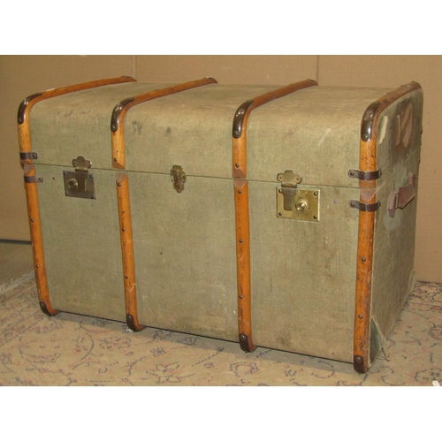 2135 - A vintage fibre and timber lathe bound cabin trunk with brass fittings and stitched leather strap ha... 