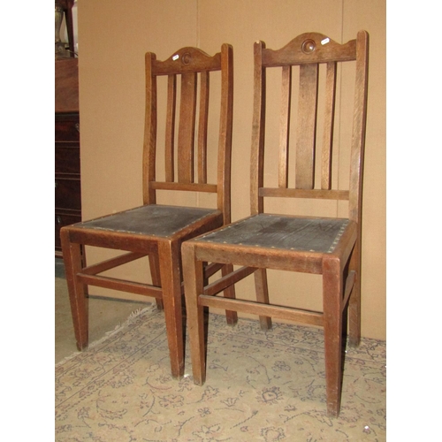 2141 - A set of four (2&2) oak restrained Arts & Crafts high slat back dining chairs with upholstered pad s... 