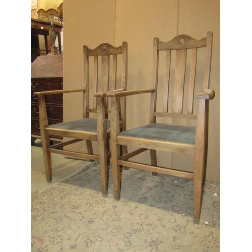 2141 - A set of four (2&2) oak restrained Arts & Crafts high slat back dining chairs with upholstered pad s... 