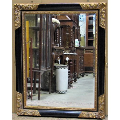 2490 - Two contemporary rectangular wall mirrors of varying design, the largest example 122 cm x 97 cm, the... 