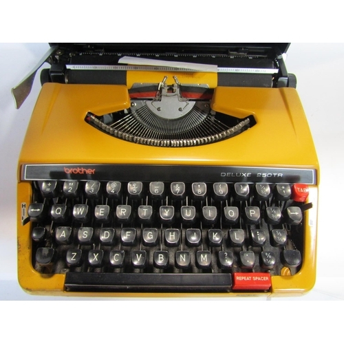 1691A - A brother Deluxe 250TR vintage typewriter in an orange colourway