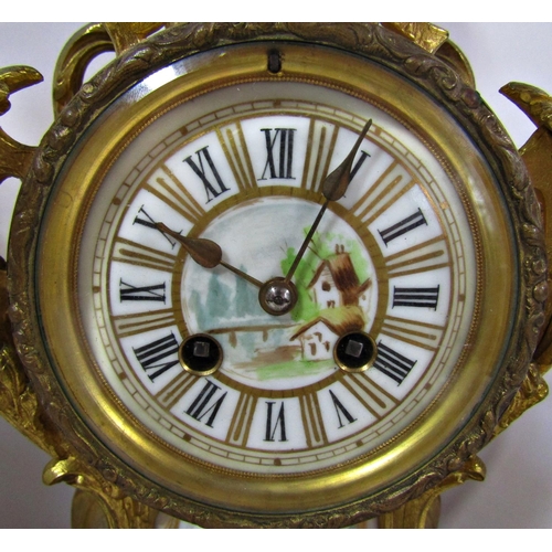 1492 - A 19th century French clock garniture with gilded finish porcelain panels and eight day striking mov... 