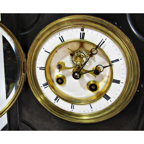 1500 - Victorian black slate mantel clock, the eight day striking movement with visible escapement