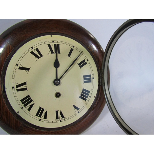 1503 - A small dial clock with oak case, chrome bezel and eight day time piece, the dial 19cm diameter