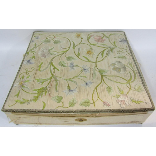 1760 - A vintage box of intricately embroidered silk floral lid raised on brass ball feet, ((af)