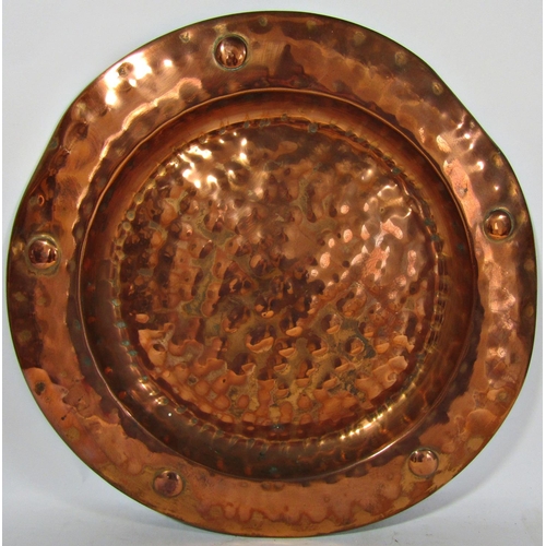 1810 - An early 20th century hand beaten copper salver, 42cm diameter approx