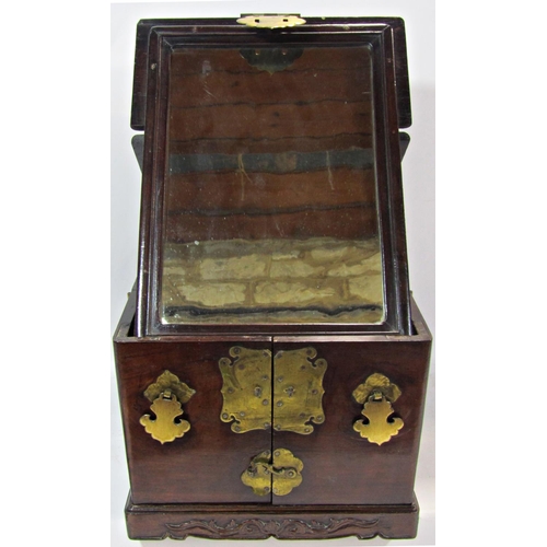 1780 - A 19th century Chinese wooden and brass overlaid travelling vanity box with foldout mirror and secti... 