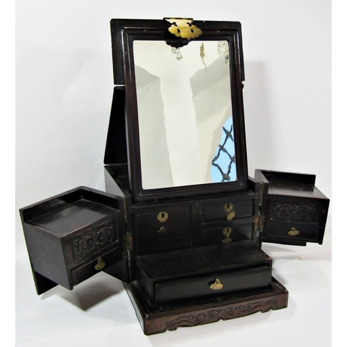 1780 - A 19th century Chinese wooden and brass overlaid travelling vanity box with foldout mirror and secti... 