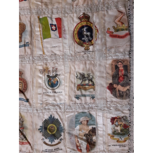 1633 - Early 20th century panel featuring a large collection of WW1 cigarette silks of regiments, flags, mi... 