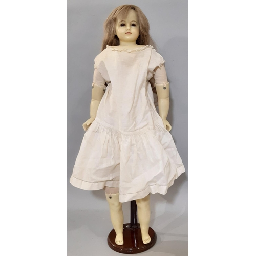 397 - 19th century wax shoulder head doll with (later) soft body, hollow wax limbs, fixed brown glass eyes... 