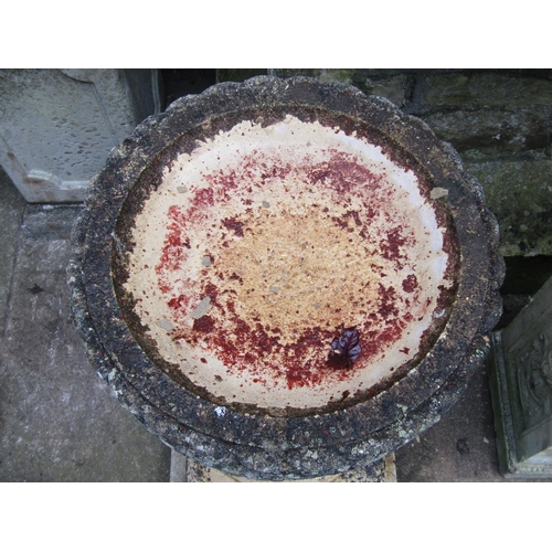 2014 - A weathered cast composition stone three sectional bird bath of circular form, 42 cm diameter x 71 c... 