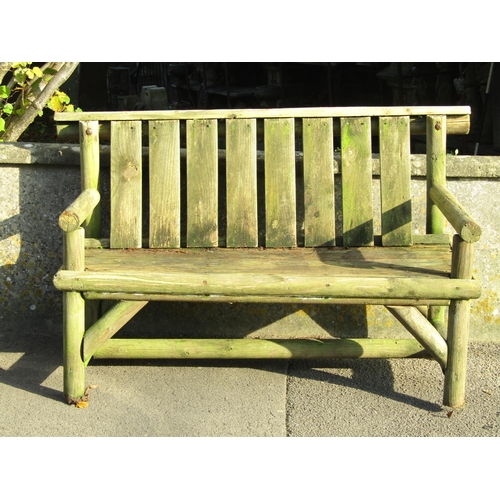 2036 - A weathered rustic two seat garden bench (af) 127 cm wide