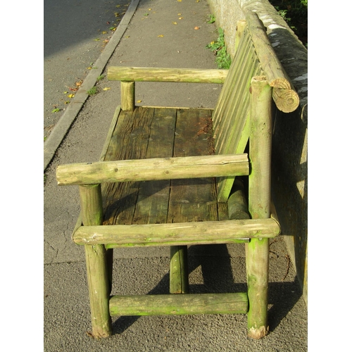 2036 - A weathered rustic two seat garden bench (af) 127 cm wide