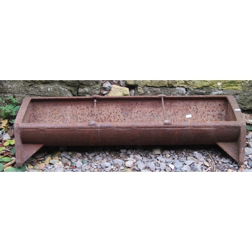 2057 - A vintage cast iron pig feeding trough of rectangular form with two simple rung divisions 96 cm long... 