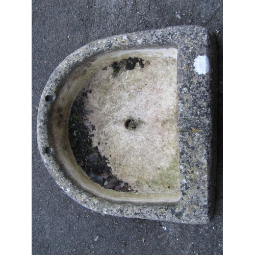 2075 - A shallow weathered composition stone D shaped trough with drainage hole and cut out channel, 46 cm ... 