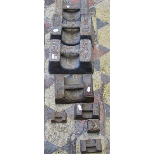 2085 - Eight cast iron weights, varying size, the largest 56lb