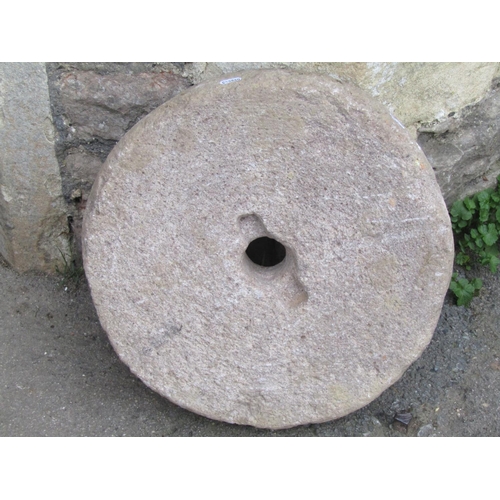 2086 - A carved stone mill/grinding wheel, 45 cm diameter