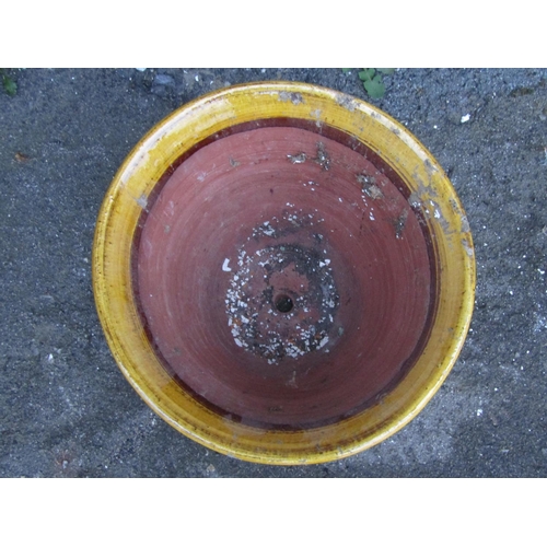 2092 - A vintage ochre glazed terracotta planter/pan of circular tapered form with flared rim, 42 cm diamet... 