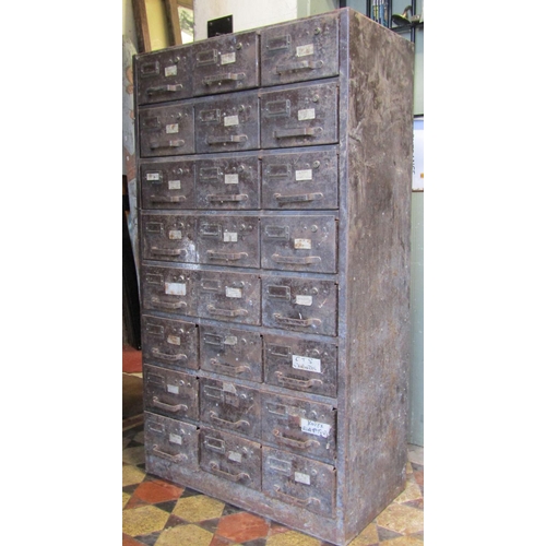 2094 - A pair of vintage industrial steel floorstanding office cabinets, each enclosing an arrangement of t... 