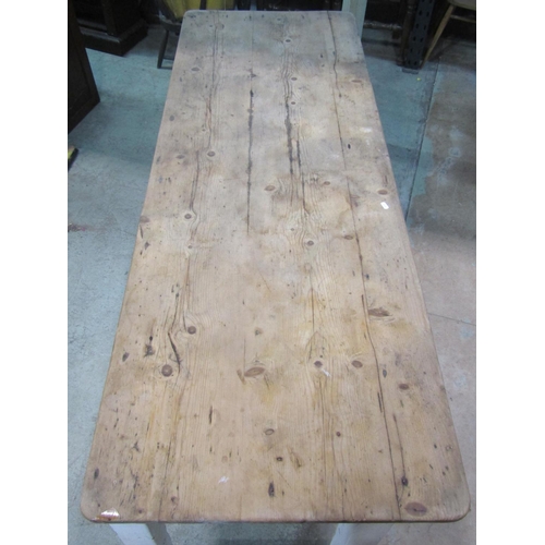 2211 - A pine scrub top kitchen table of rectangular form raised on painted square tapered supports partial... 