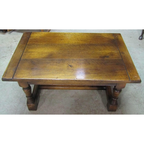 2215 - A good quality oak occasional table in the Old English style, the rectangular top with cleated ends ... 