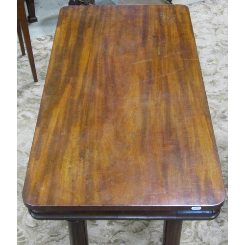 2302 - A Victorian mahogany rectangular centre/library table with moulded outline, raised on turned tulips ... 