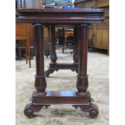 2302 - A Victorian mahogany rectangular centre/library table with moulded outline, raised on turned tulips ... 