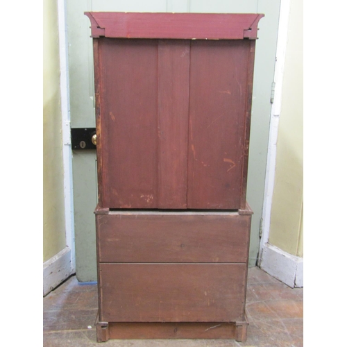 2678 - A Victorian mahogany cabinet of small proportions, the lower section enclosed by two frieze drawers,... 