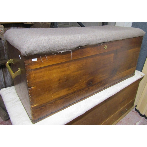 2621 - An old pine blanket chest, the rising lid with upholstered finish, 125 cm length