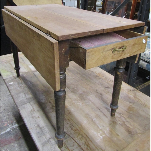 2626 - A Victorian drop leaf kitchen table in pine enclosing a single frieze drawer on turned supports 107 ... 