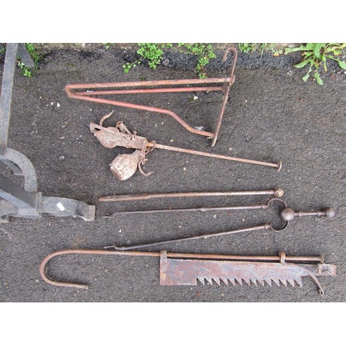 2162 - A large wrought iron Arts & Crafts style andiron together with a 19th century chimney crane, two fir... 