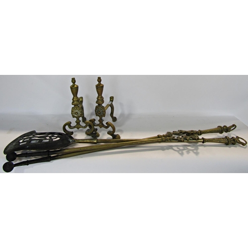 1789 - A pair of 19th century brass fire tongs and shovel together with a pair of brass andirons