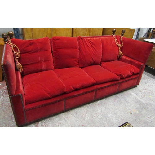 2628 - A pair of very large knoll sofas of traditional form upholstered in red velvet with bar stud detail,... 