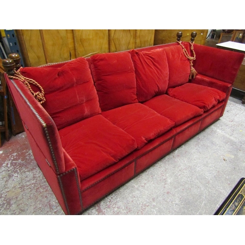 2628 - A pair of very large knoll sofas of traditional form upholstered in red velvet with bar stud detail,... 