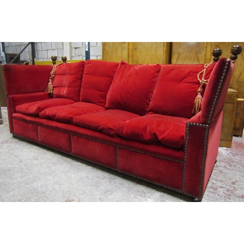 2628 - A pair of very large knoll sofas of traditional form upholstered in red velvet with bar stud detail,... 