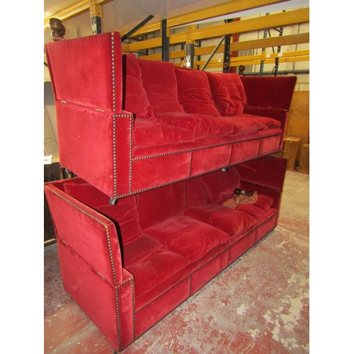 2628 - A pair of very large knoll sofas of traditional form upholstered in red velvet with bar stud detail,... 