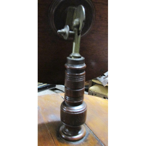 2629 - A Victorian walnut shaving stand with adjustable circular mirror raised on turned column and tripod