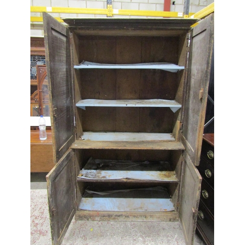 2633 - A Victorian pine two tier cabinet, the lower section enclosed by two panelled doors, the upper secti... 