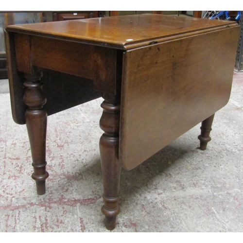 2634 - A 19th century mahogany drop leaf dining table on four turned supports, the top with swivel action t... 