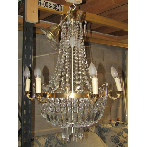 2640 - A six branch chandelier in brass and cut glass approx height 70 cm plus chain, 60 cm diameter