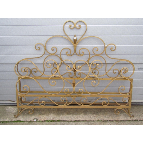 2642 - An unusual iron work bedstead with scrolled detail and painted finish to accept a 5ft mattress