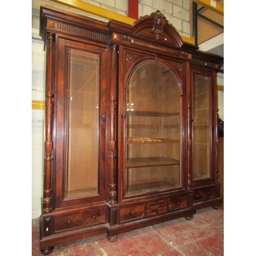 2645 - A good quality 19th century rosewood breakfront cabinet, the glazed doors in three sections enclosin... 