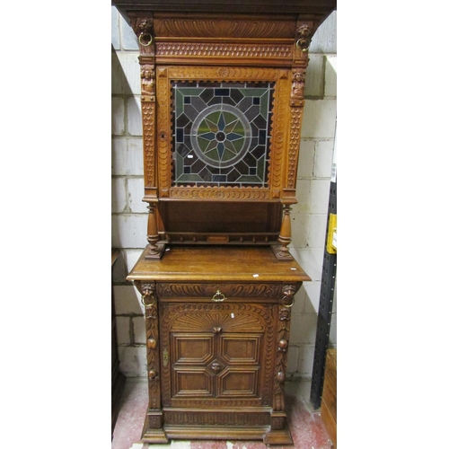 2649 - A 19th century oak pier cabinet, the lower section enclosed by a quarter panelled door and frieze dr... 