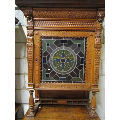 2649 - A 19th century oak pier cabinet, the lower section enclosed by a quarter panelled door and frieze dr... 